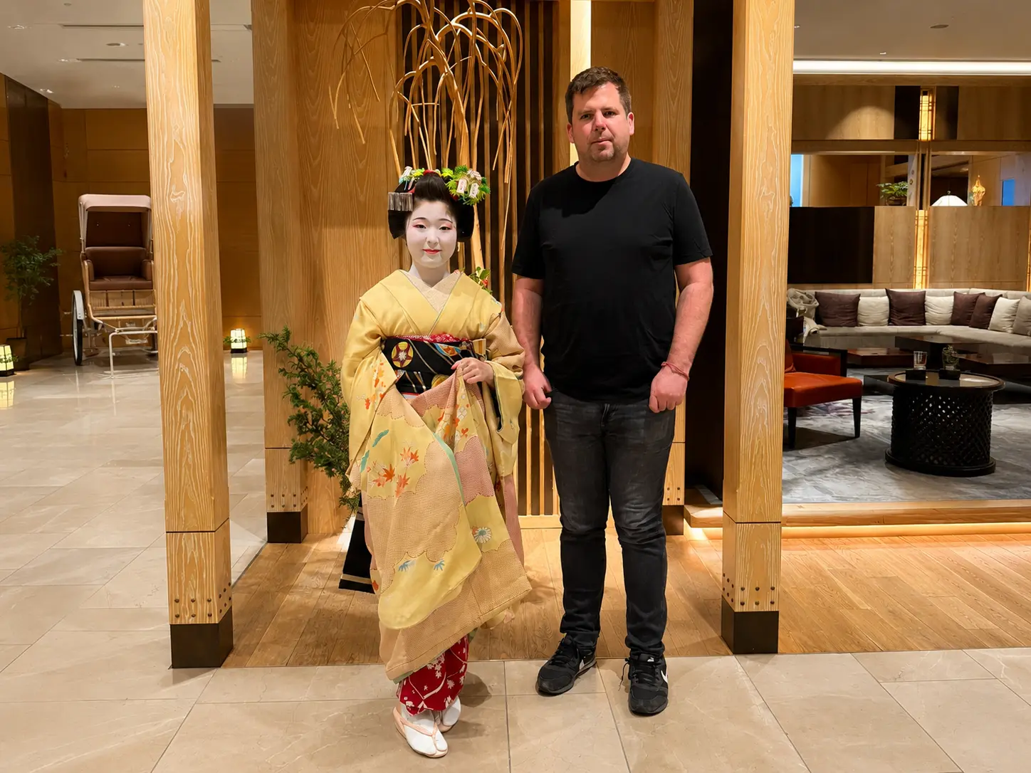 Dylan Clements of Clements Travel meeting a maiko after a cultural performance at Four Seasons Hotel Kyoto.