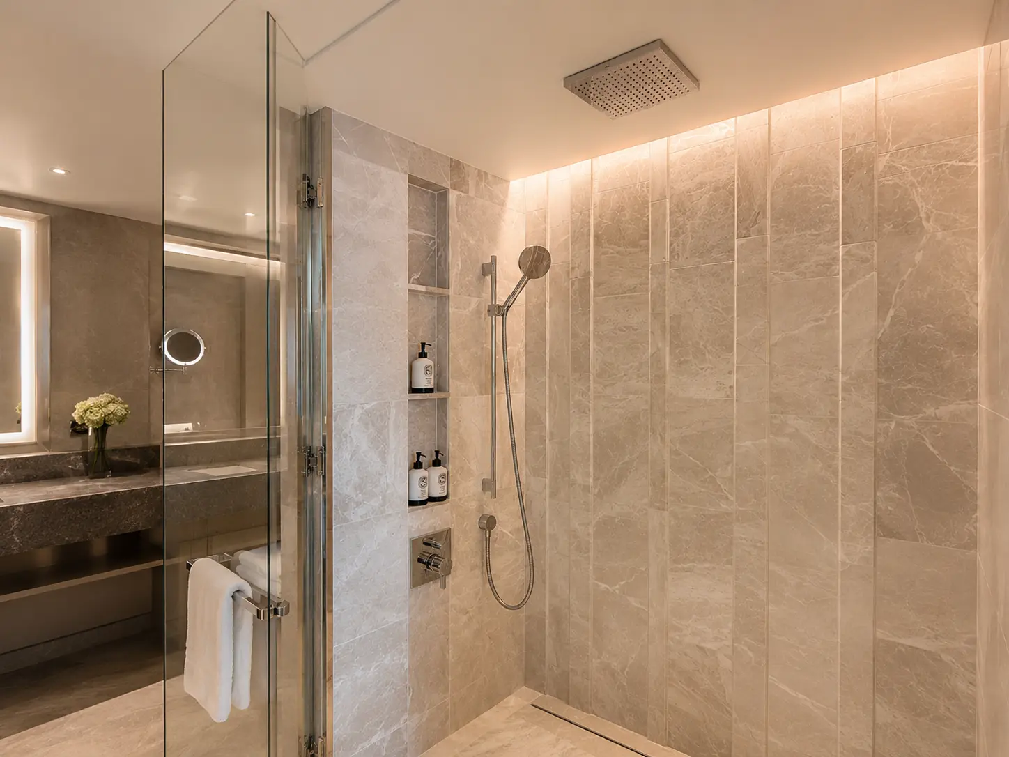 Walk-in rainfall shower in a Deluxe Room bathroom at Four Seasons Hotel Kyoto.