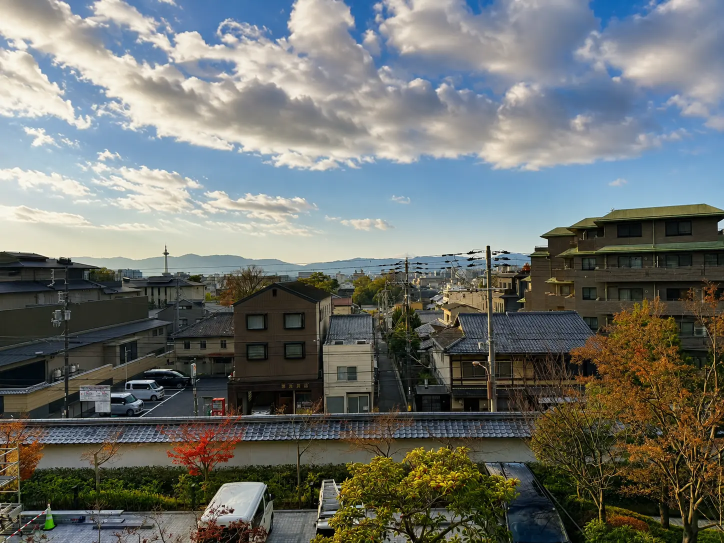 City view from a Deluxe Room at Four Seasons Hotel Kyoto with Kyoto Tower visible in the distance.