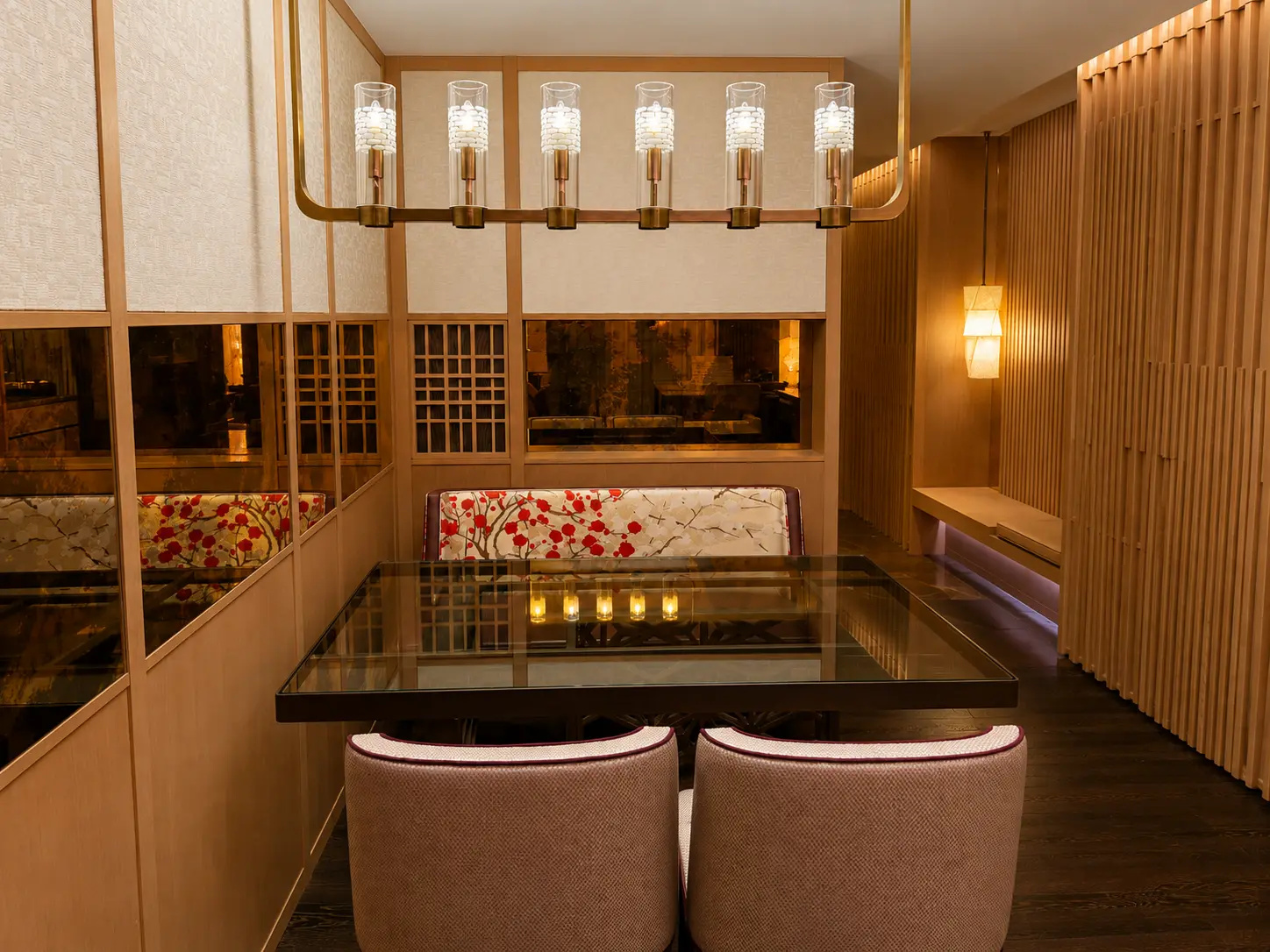 Dining area inside a residence at Four Seasons Hotel Kyoto with glass dining table, Japanese-inspired seating and timber detailing.