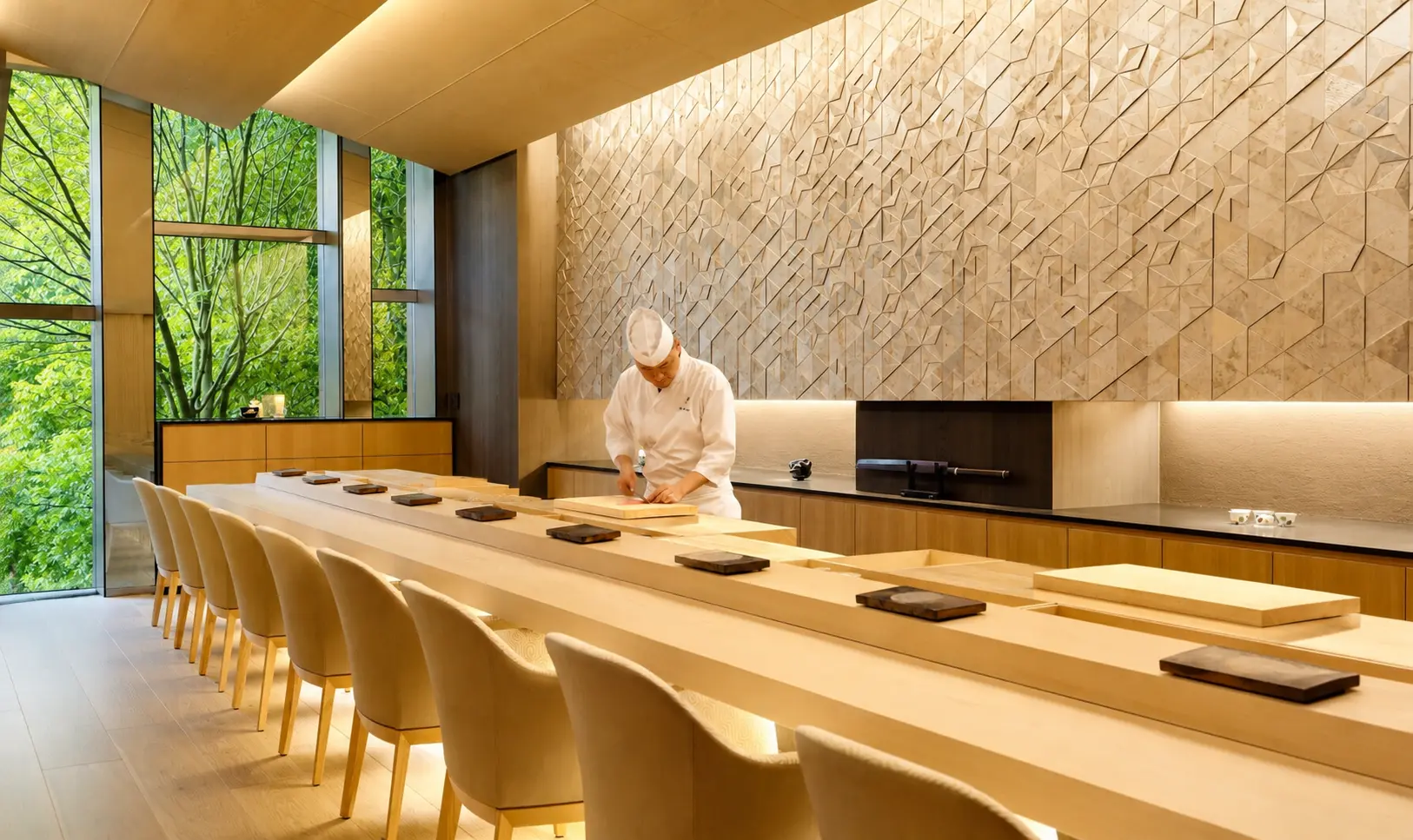 Sushi chef preparing omakase at the counter inside Sushi Ginza Onodera at Four Seasons Hotel Kyoto.