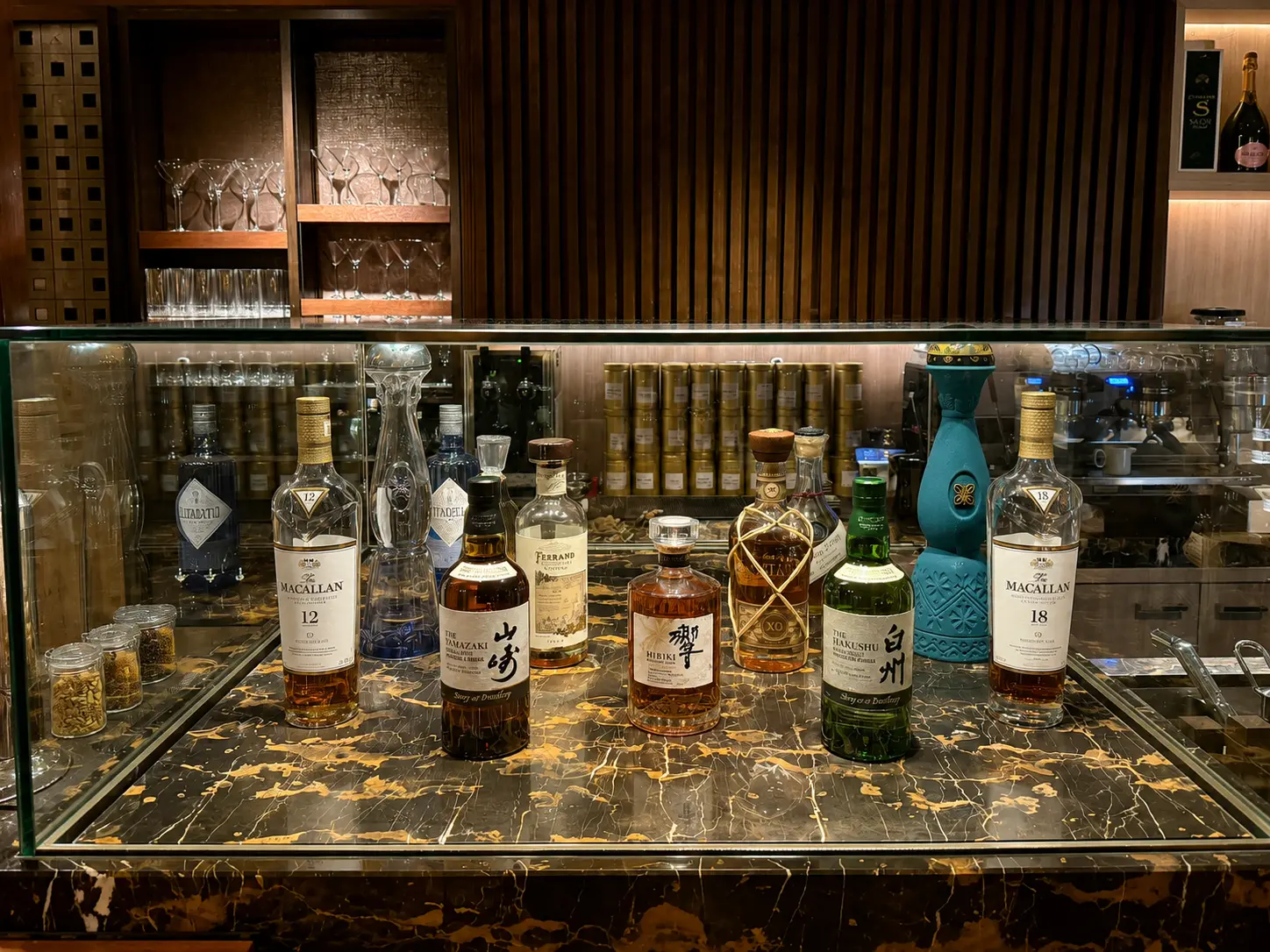 Japanese whisky collection at SEY Bar at Four Seasons Hotel Kyoto including Yamazaki, Hibiki and Hakushu.