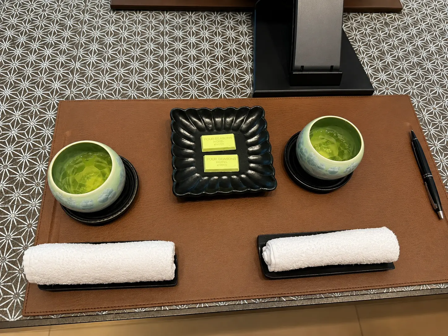 Japanese green tea, chilled towels and Four Seasons Kyoto chocolates served during check-in.