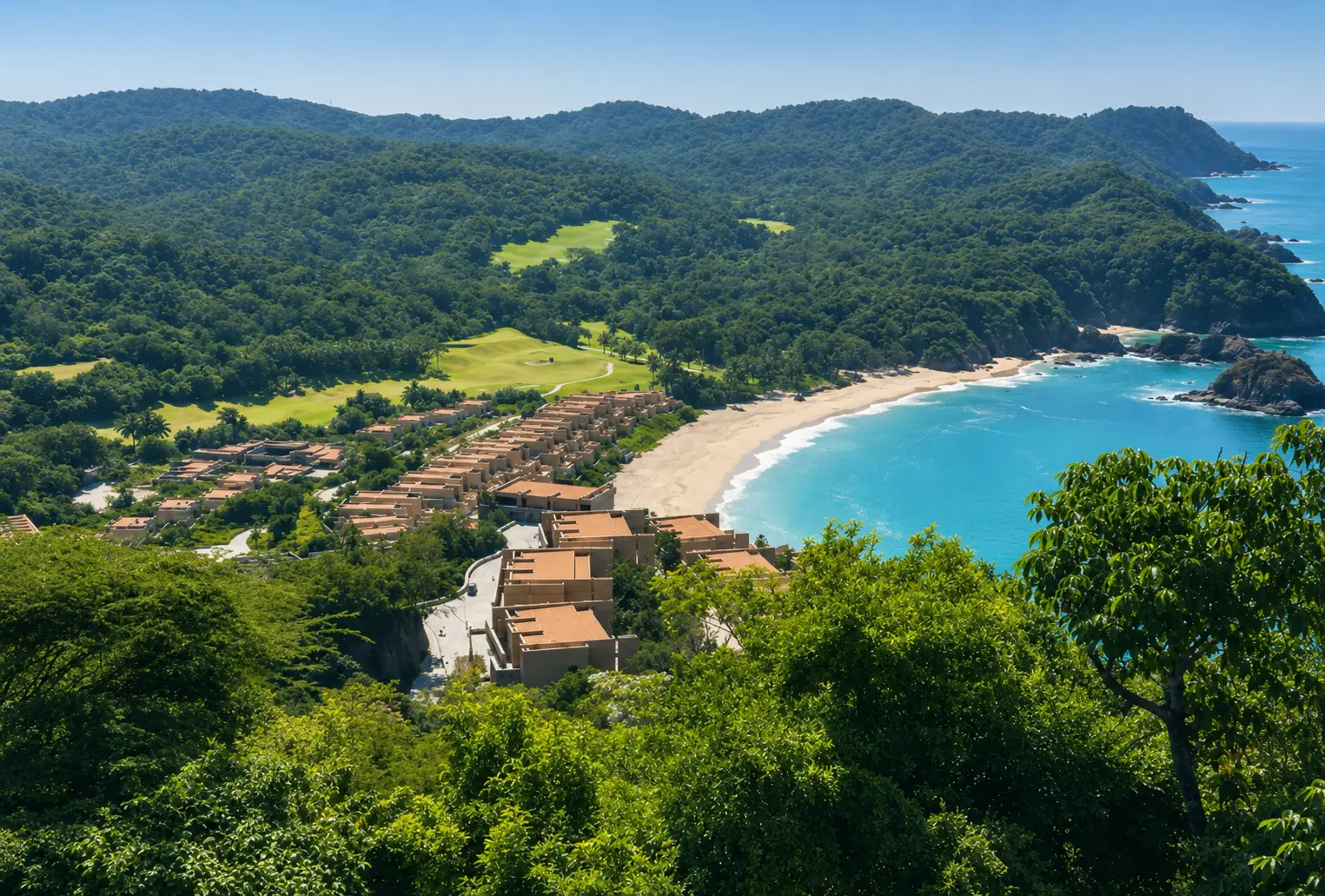 Aerial view of Four Seasons Resort Tamarindo overlooking a sandy beach, lush tropical forest and the Pacific Ocean in Mexico.