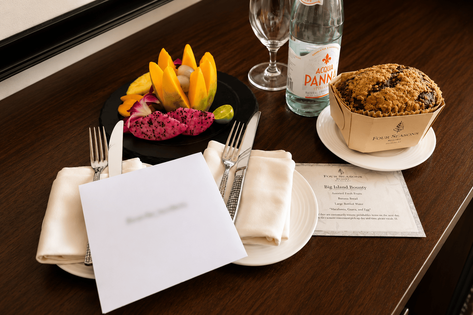 Four Seasons Resort Hualalai welcome amenity with fresh fruit, banana bread and bottled water