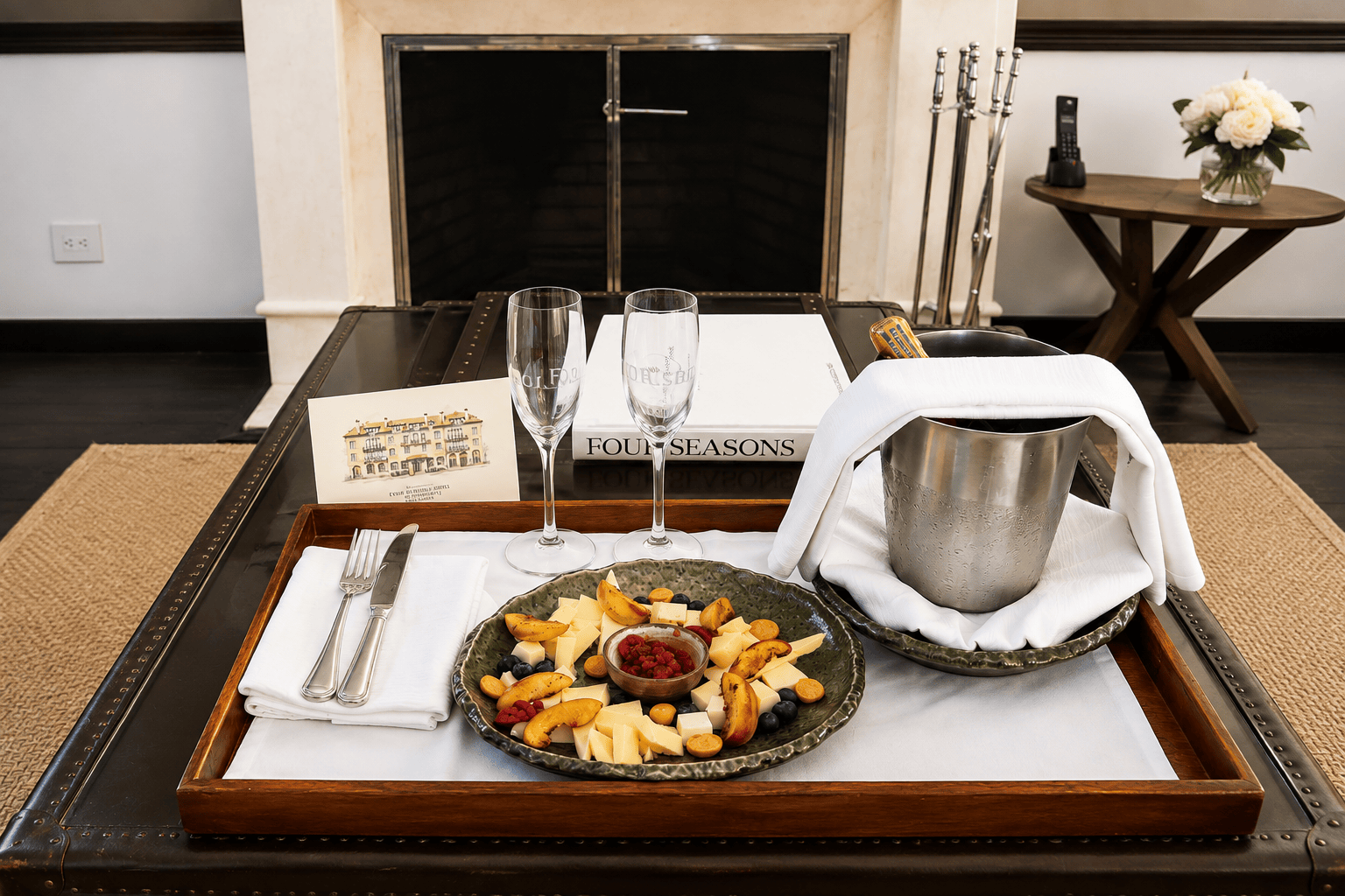 Four Seasons welcome amenity with champagne, fruit and cheese arranged before guest arrival