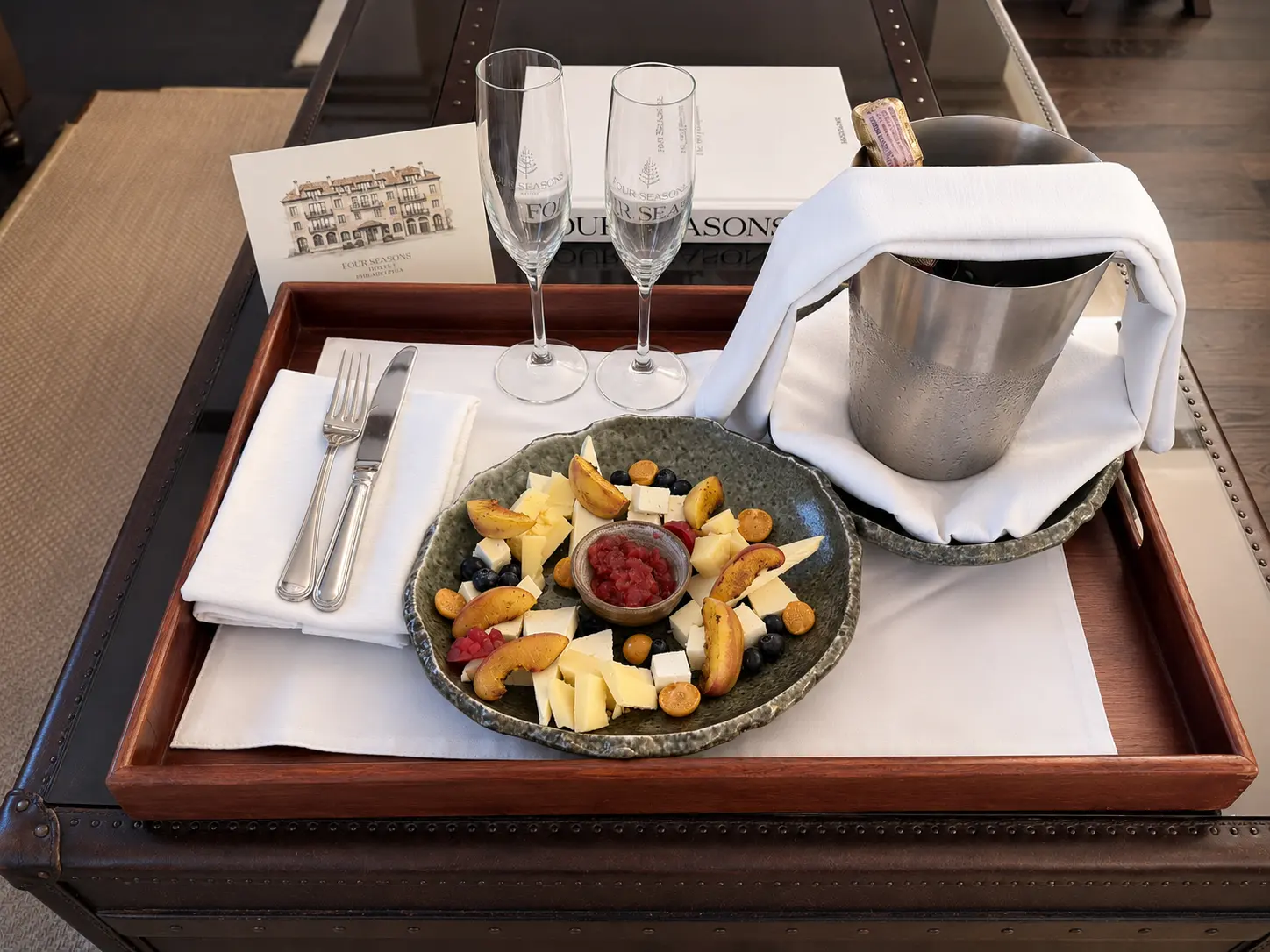 Four Seasons Preferred Partner welcome amenity at Four Seasons Hotel Casa Medina Bogotá with sparkling wine, fruit and cheese.