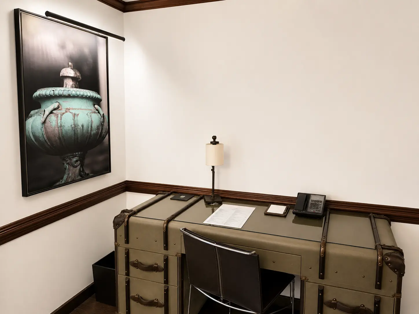 Writing desk in an Executive Suite With Fireplace at Four Seasons Hotel Casa Medina Bogotá with trunk-style design and leather chair.