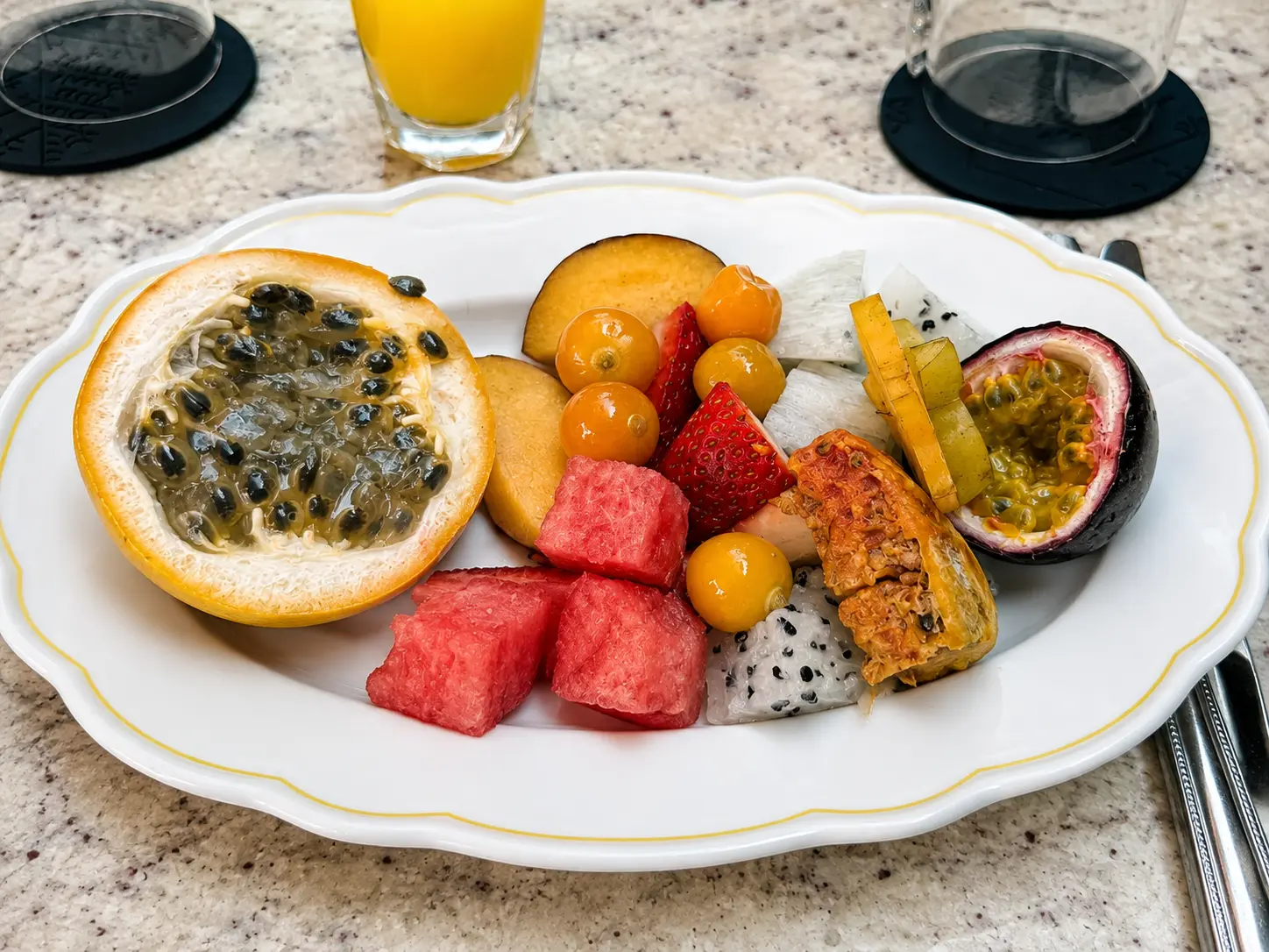 Tropical fruit breakfast at Four Seasons Hotel Casa Medina Bogotá with passion fruit, watermelon, strawberries, dragon fruit and golden berries.
