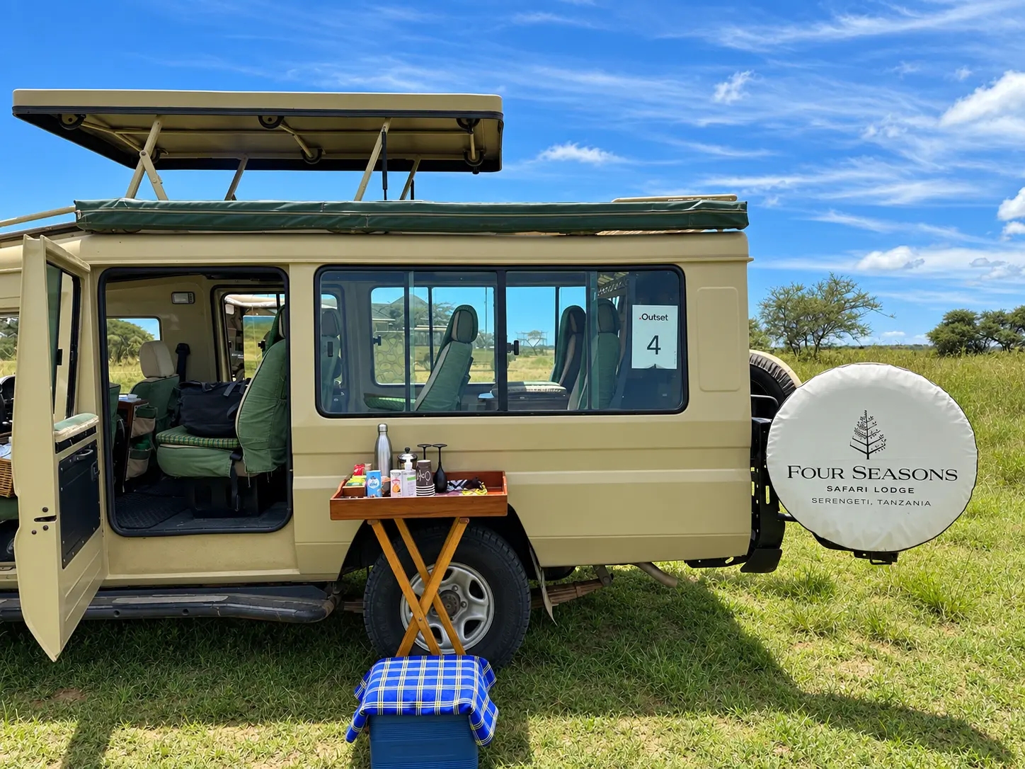 Four Seasons Safari Lodge Serengeti safari vehicle waiting at Seronera Airstrip