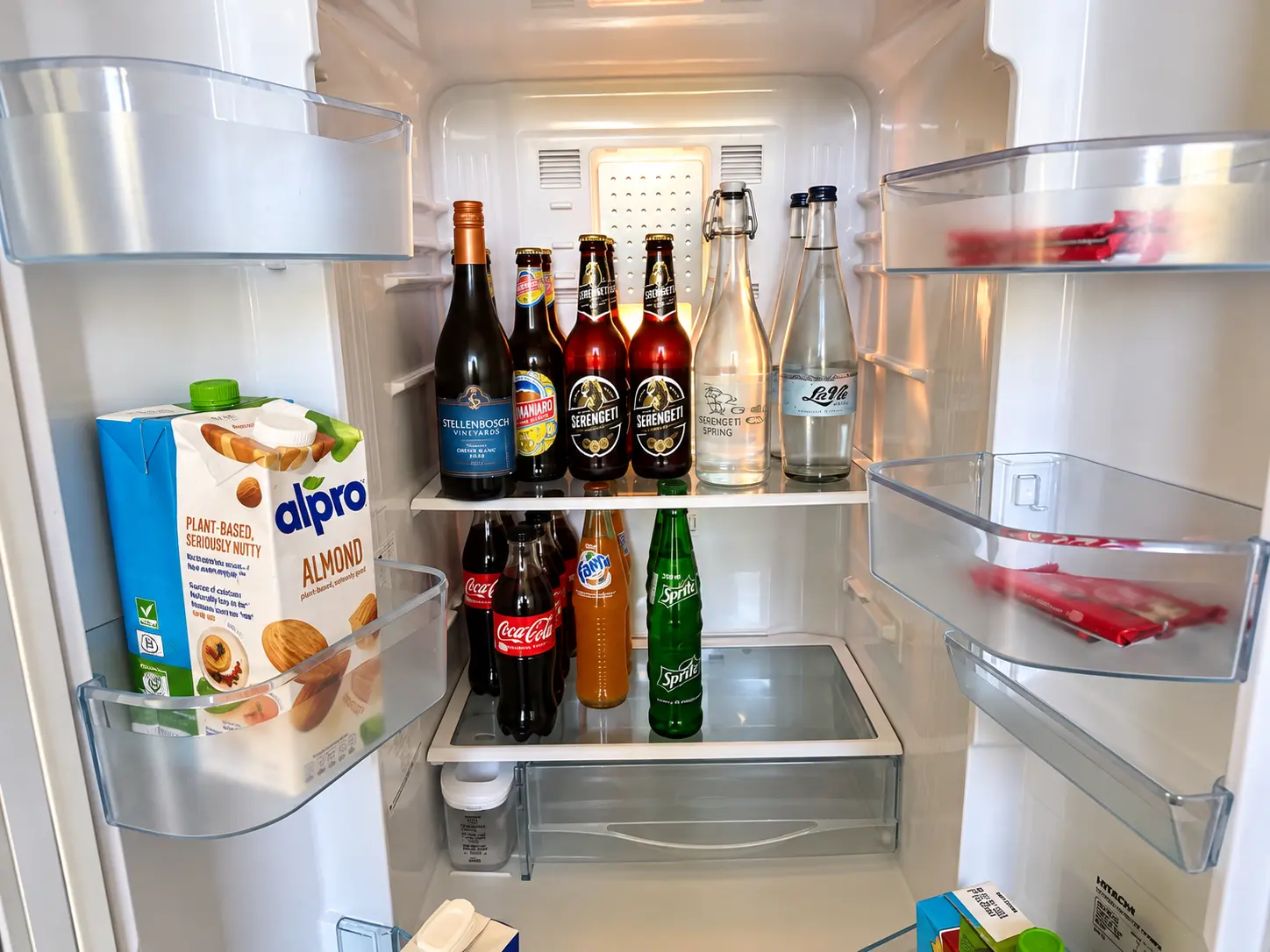 Stocked refrigerator and minibar in a One-Bedroom Villa at Four Seasons Safari Lodge Serengeti, Tanzania.
