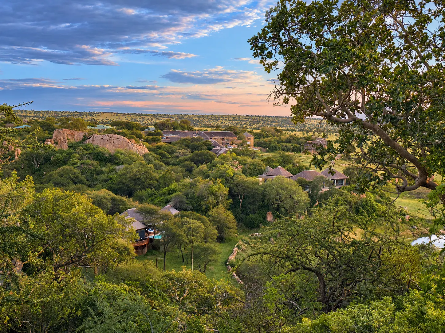 Four Seasons Safari Lodge Serengeti surrounded by bush and rocky outcrops in Serengeti National Park, Tanzania.