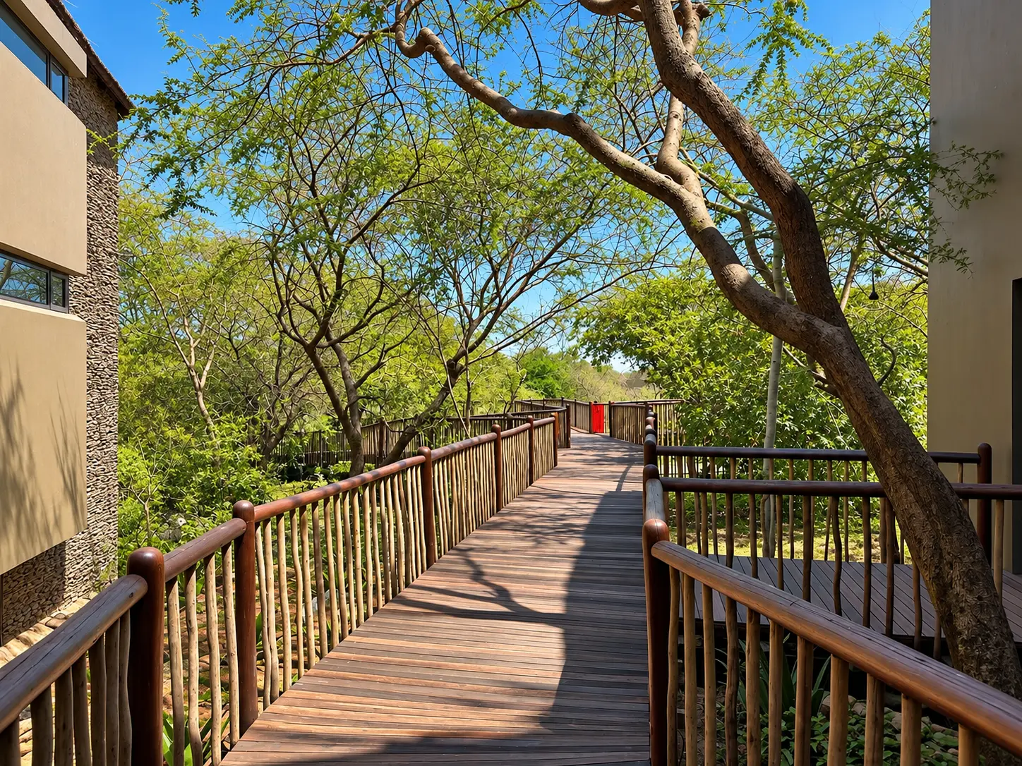 Elevated wooden walkways connecting guest rooms at Four Seasons Safari Lodge Serengeti in Tanzania.