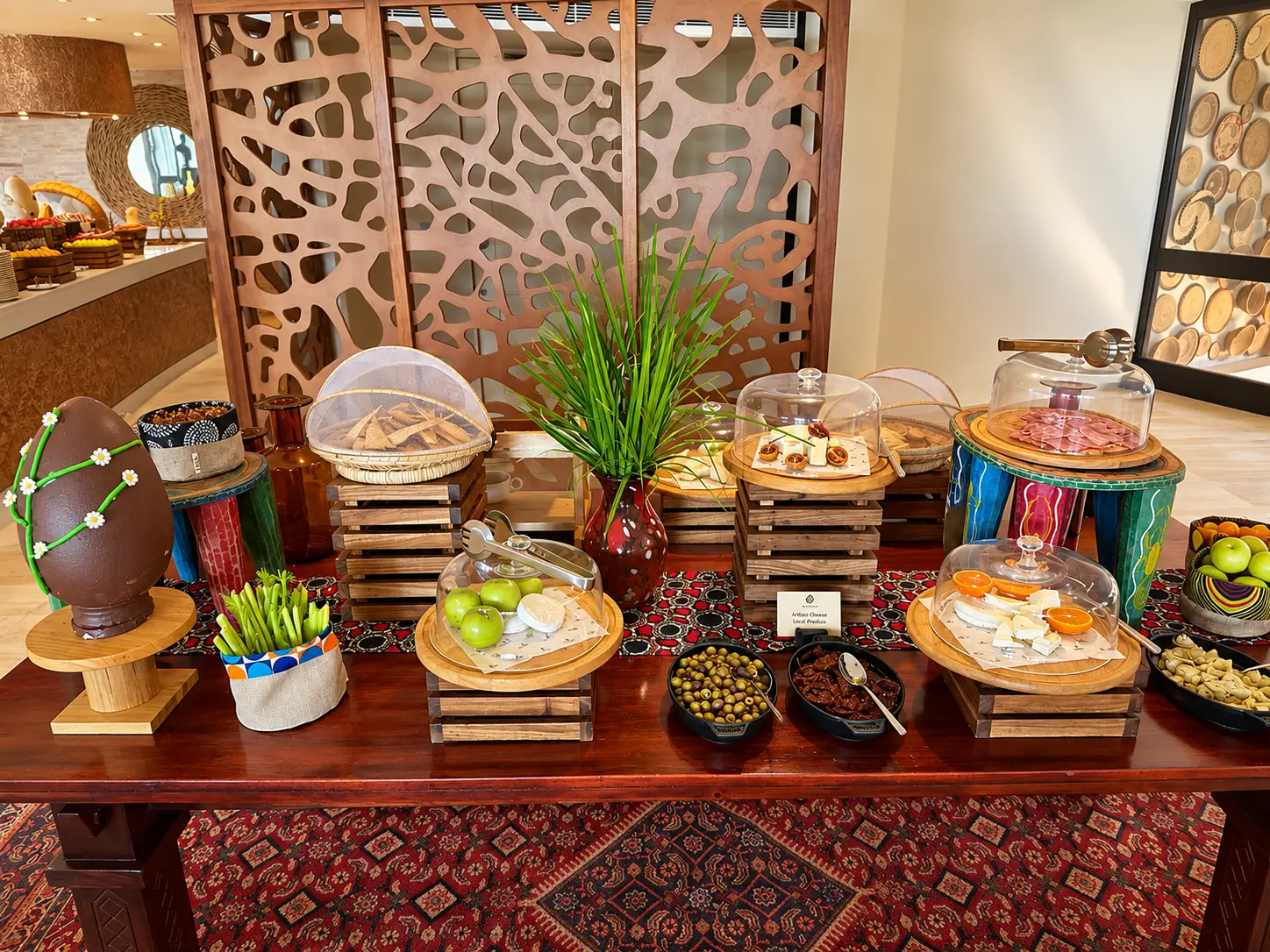 Breakfast buffet at Four Seasons Safari Lodge Serengeti with fruit, cheese, cold cuts and pastries.