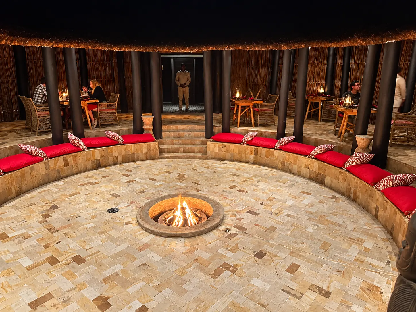 The central firepit and dancing area at Boma Grill, used for evening cultural performances at Four Seasons Safari Lodge Serengeti. Photo by Dylan Clements / Clements Travel.