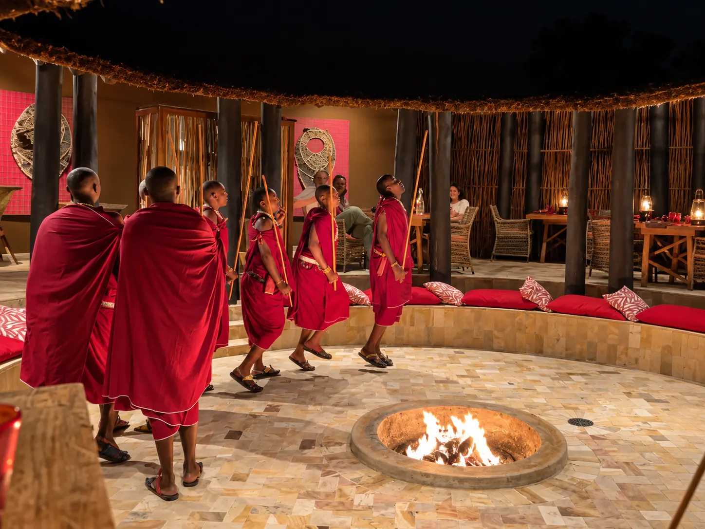 Maasai cultural performance during dinner at Boma Grill at Four Seasons Safari Lodge Serengeti in Tanzania.