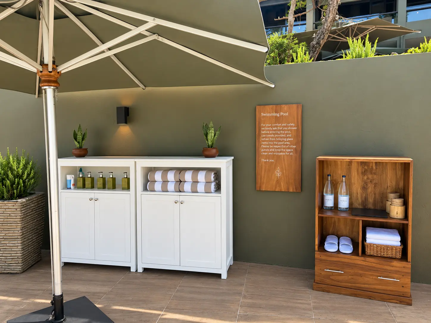 Complimentary sunscreen, insect repellent and bottled water available beside the pool at Four Seasons Safari Lodge Serengeti.