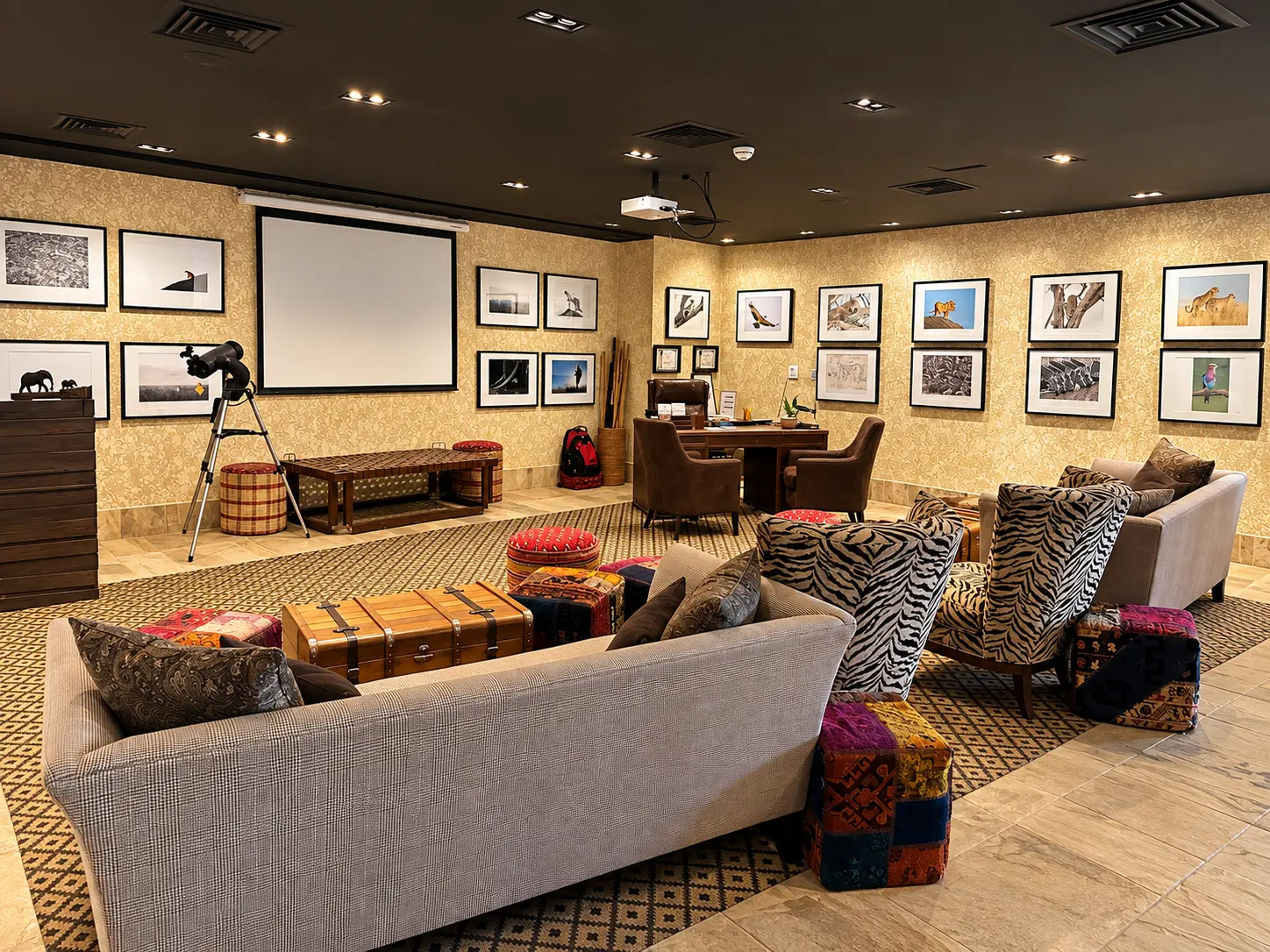 Lounge and presentation area inside the Discovery Centre at Four Seasons Safari Lodge Serengeti in Tanzania.