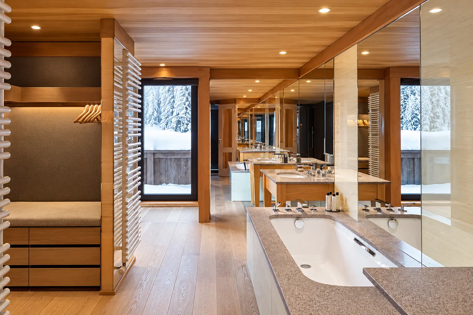 Bathroom in a Chambre Ski Piste at Aman Le Mélézin with bathtub, large mirrors and warm timber finishes.