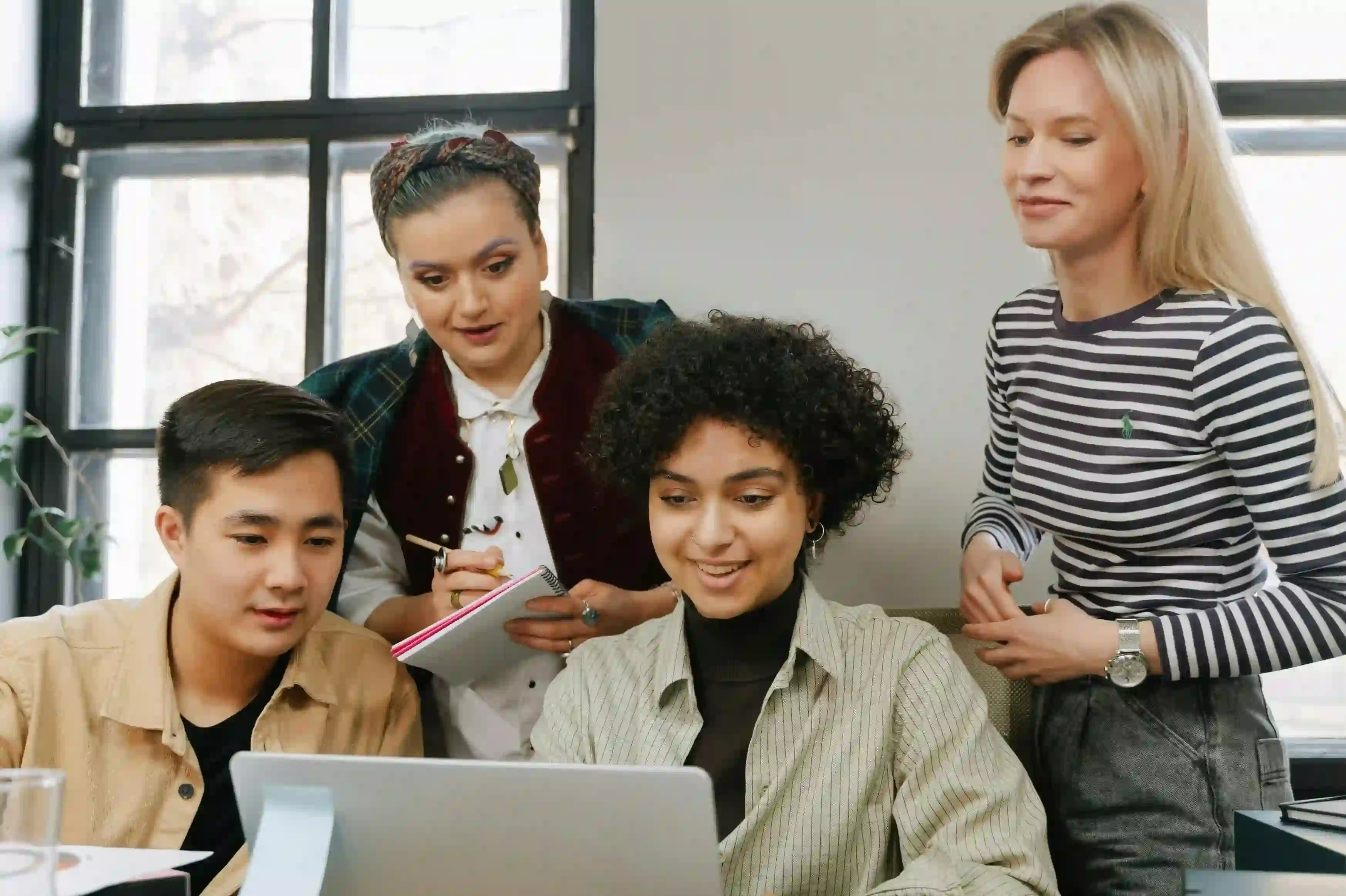 A team working around a computer