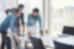 Team collaborating on incentives and rewards strategy in a modern workplace
