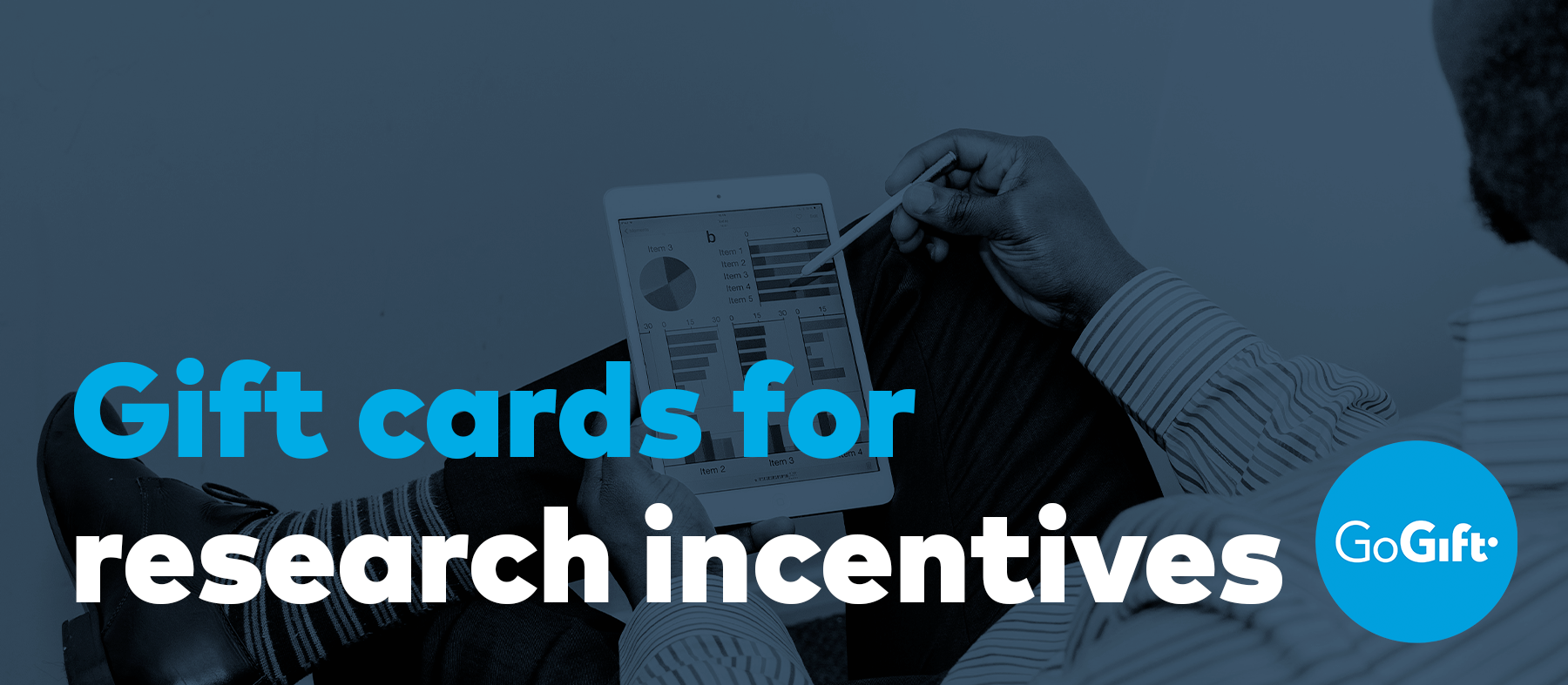 Blog banner reading "Gift cards for research incentives", showing a person holding a tablet displaying a chart