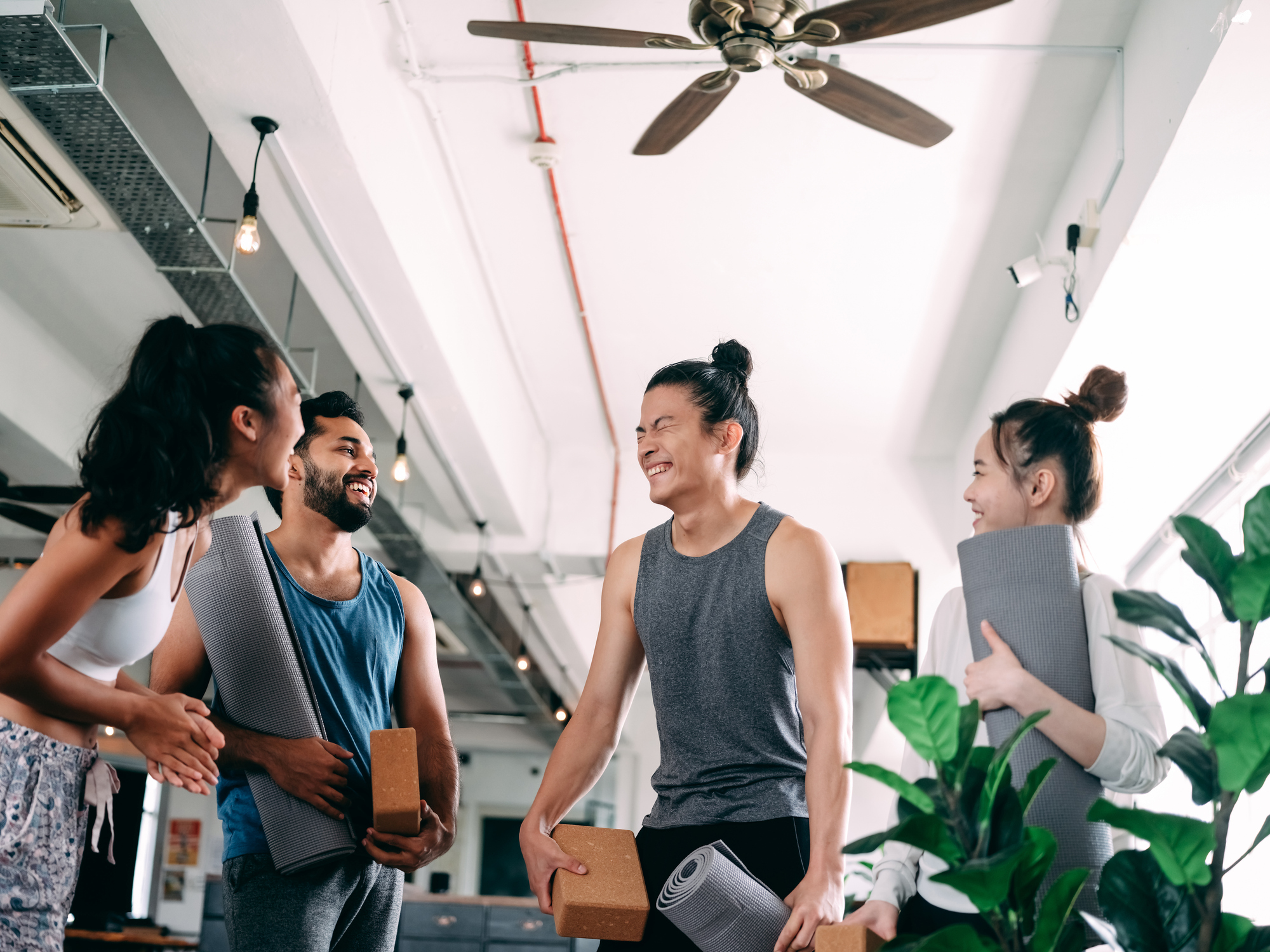 team working together in a collaborative atmosphere, and of employees participating in wellness activities