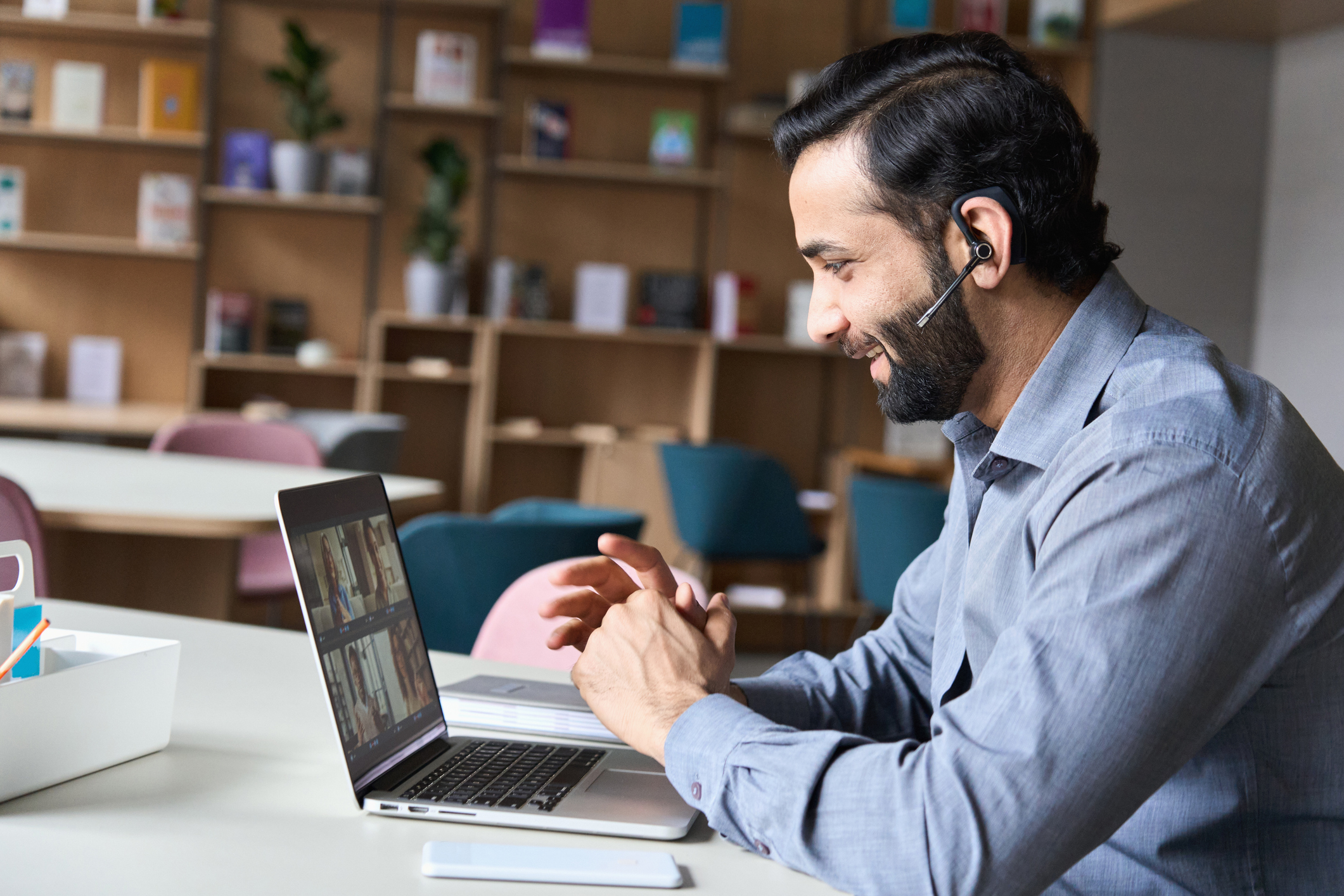An illustration of four different people each on their computer, working remotely
