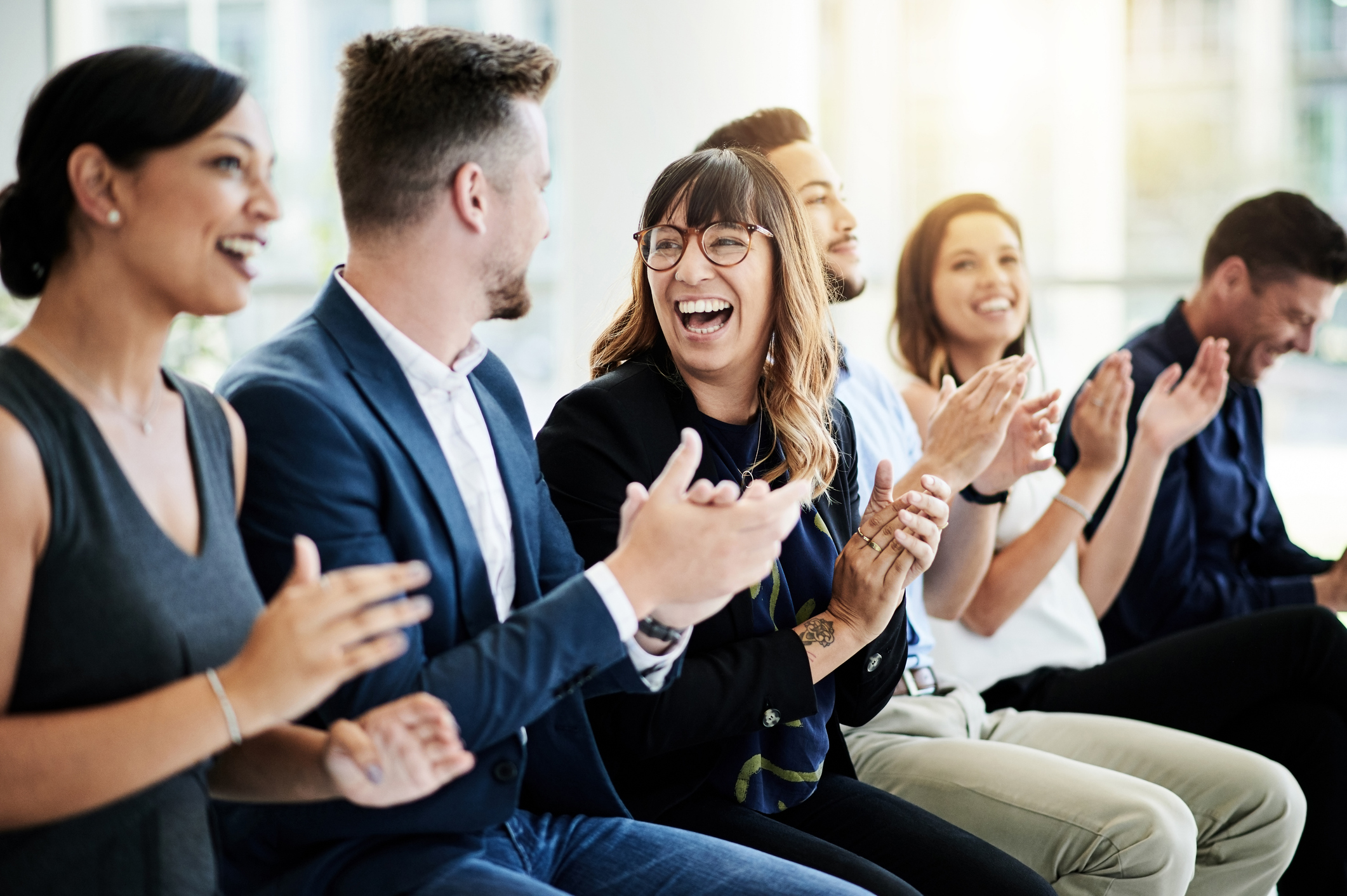 Two people shaking hands in the workplace