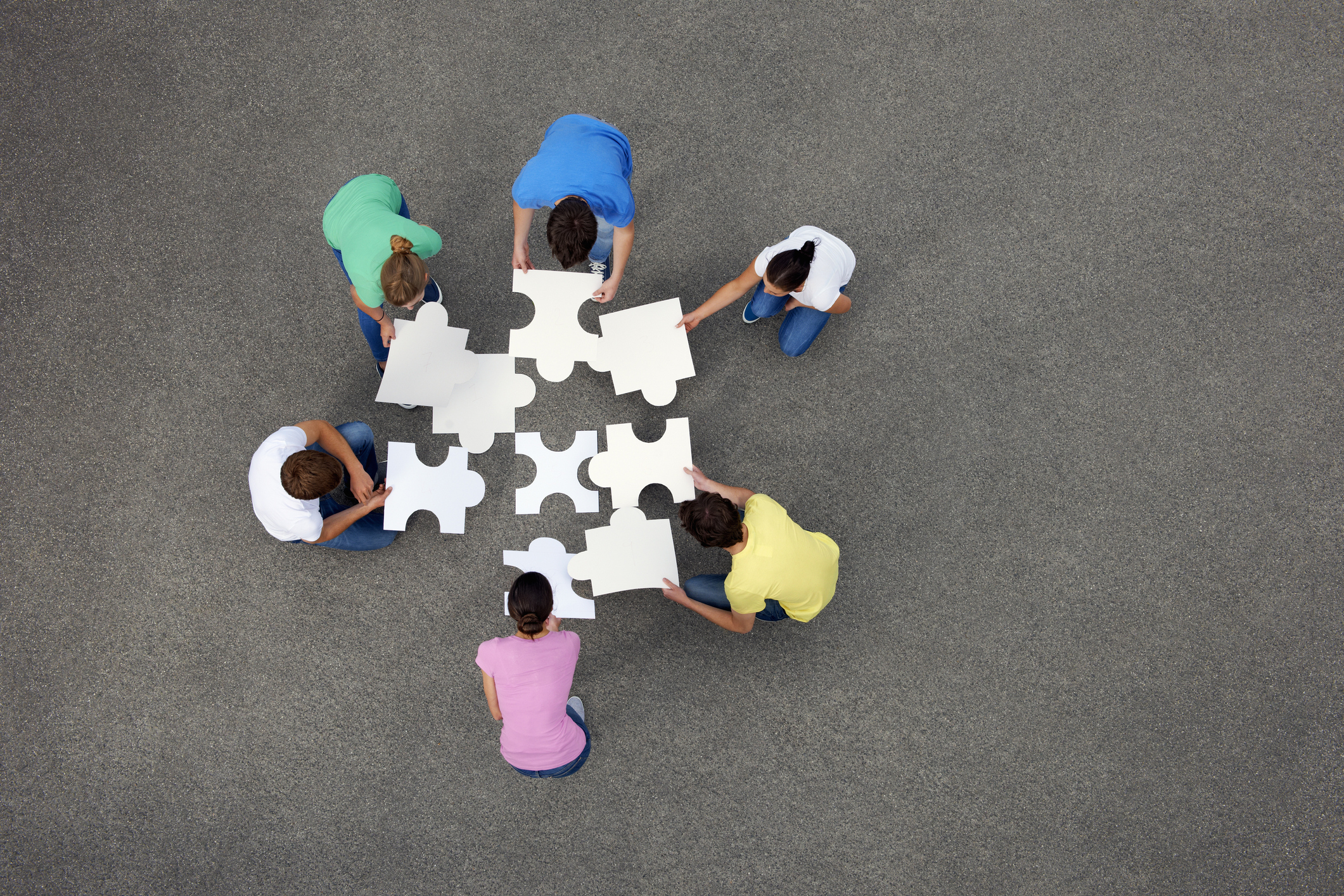 a diverse team in an office setting of different ages and genders and ethnicitiesa diverse team in an office setting of different ages and genders and ethnicities