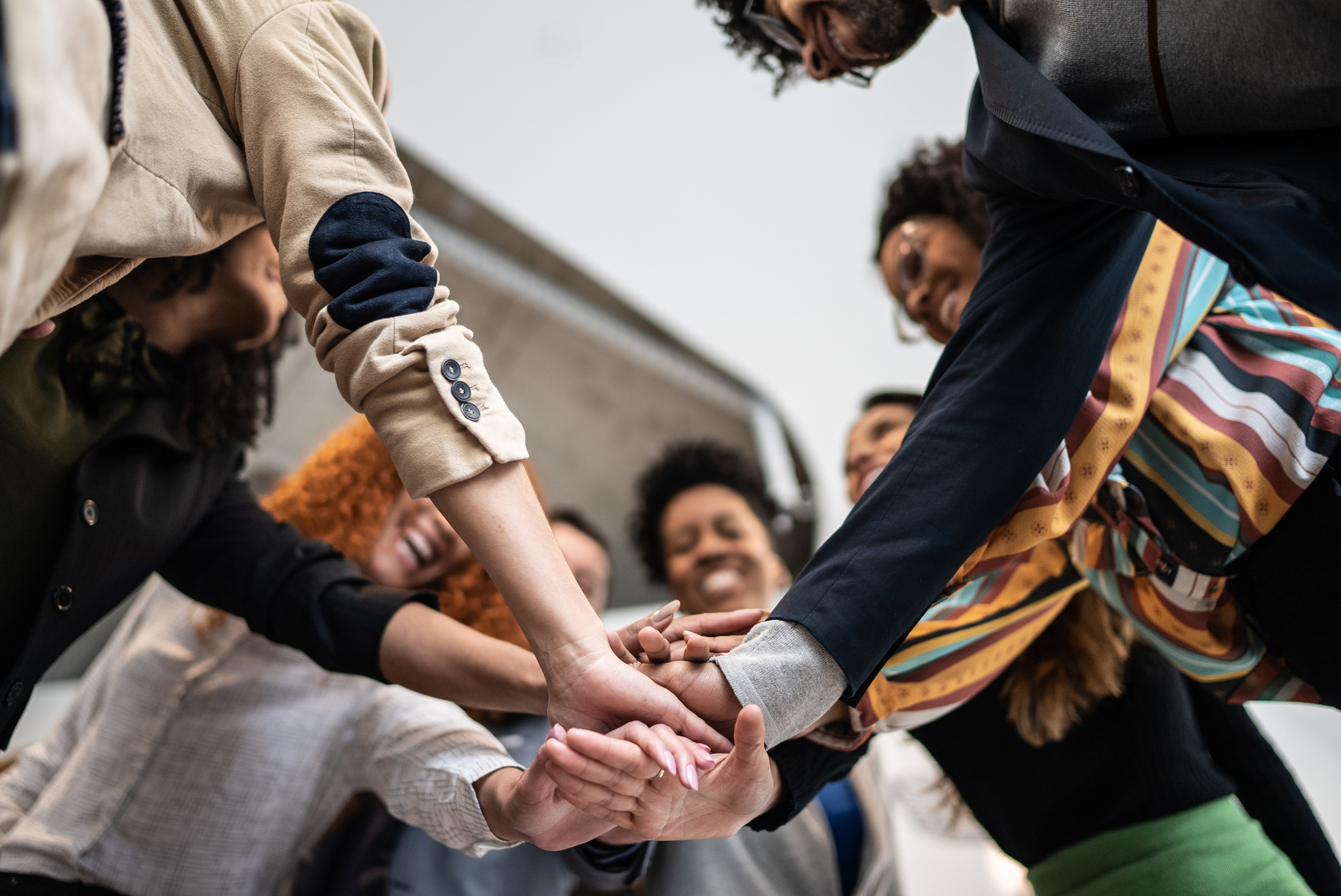 An illustration of people collaborating to make a well functioning engine