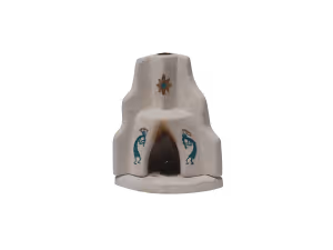 Small white ornamental structure with a sun symbol and decorative turquoise lizards on the sides.