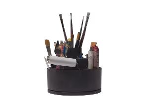 Rotating black organizer holding paintbrushes, scissors, and a white roller brush on a black background.