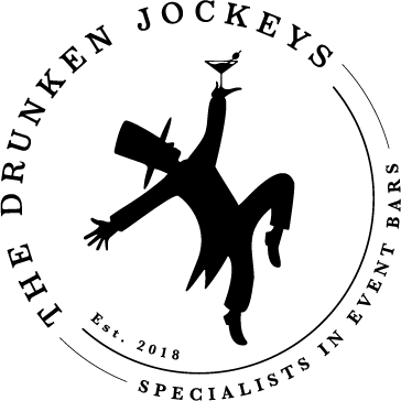 Silhouette of a dancing jockey with a top hat and bird on hand in a circular logo for The Drunken Jockeys.