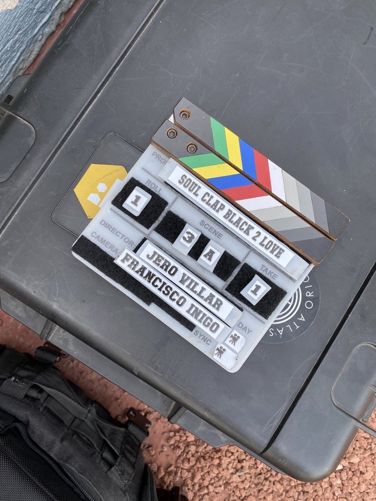 Film clapperboard lying on a dark surface