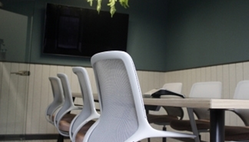 Another view of the Vault meeting rooms showing the chairs with the TV in the background