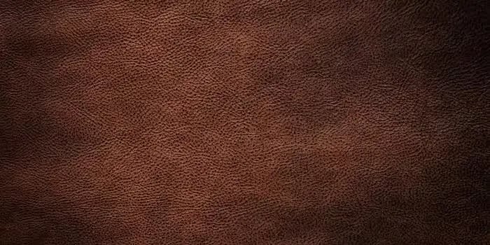 Close-up texture of brown leather surface.
