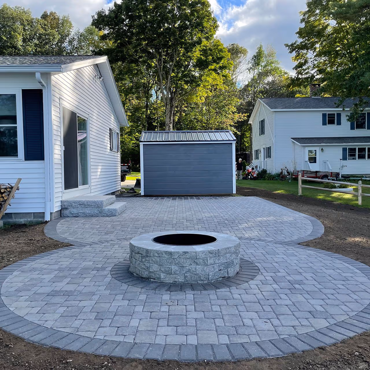 outdoor fire pit installation hardscape Gardiner Maine CamCo Lawn Care