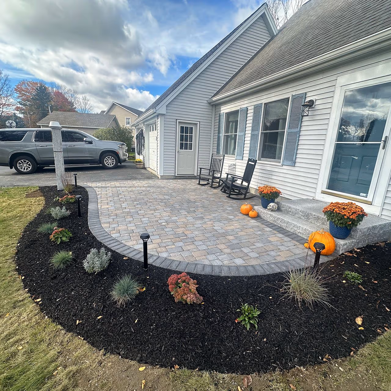 black mulch installation around shrubs and plants