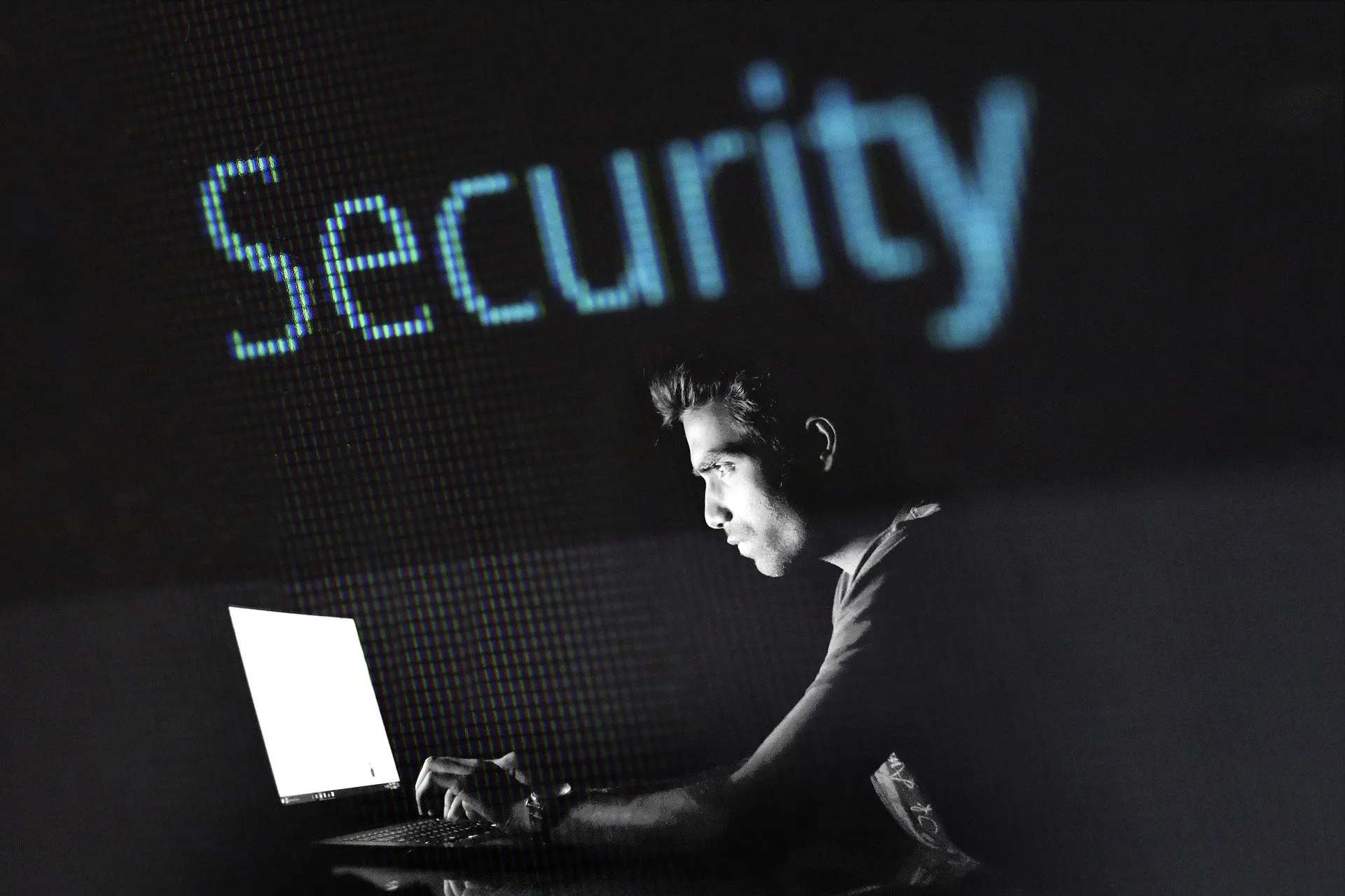 Someone looking at a screen, with "Security" written above.