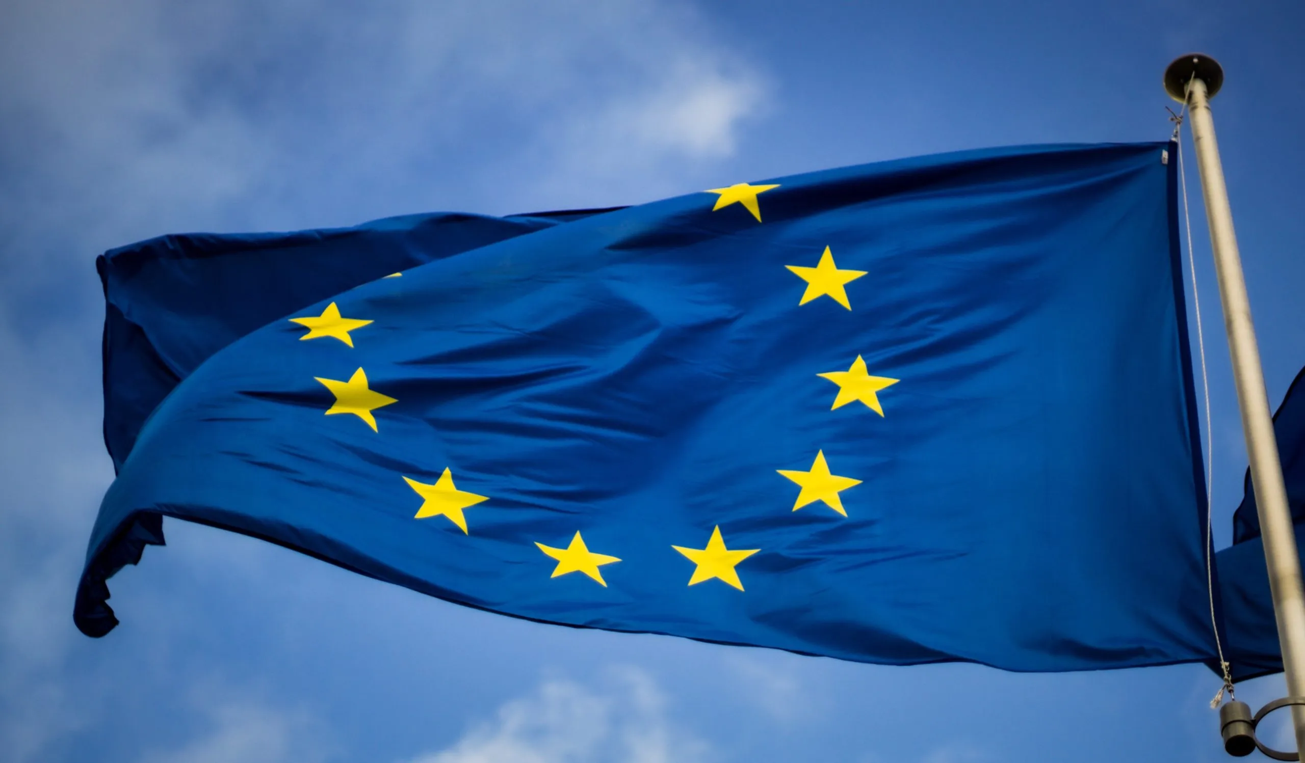 EU flag against a blue sky.
