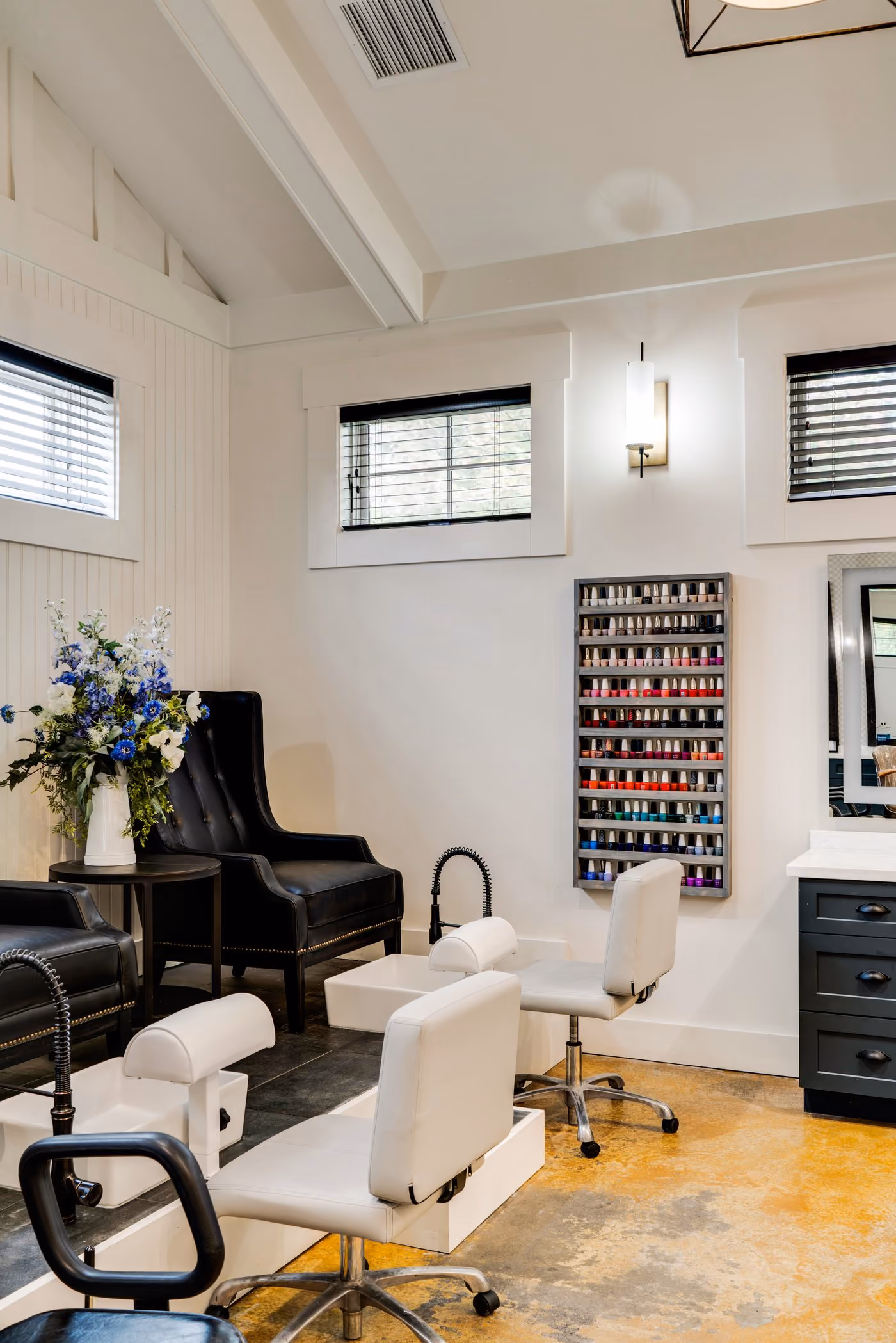 Pedicure room with nail polish wall display at the Chesapeake Bay Beach Club spa salon