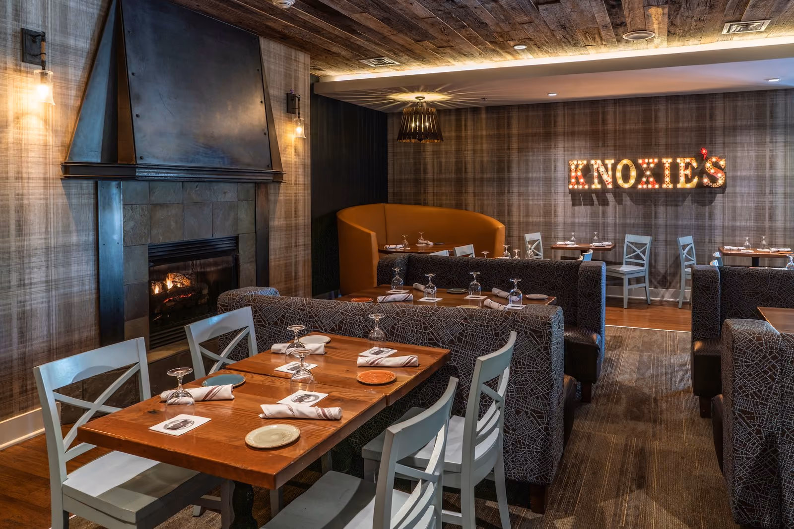 Cozy fireplace seating in Knoxie's dining room at Chesapeake Bay Beach Club