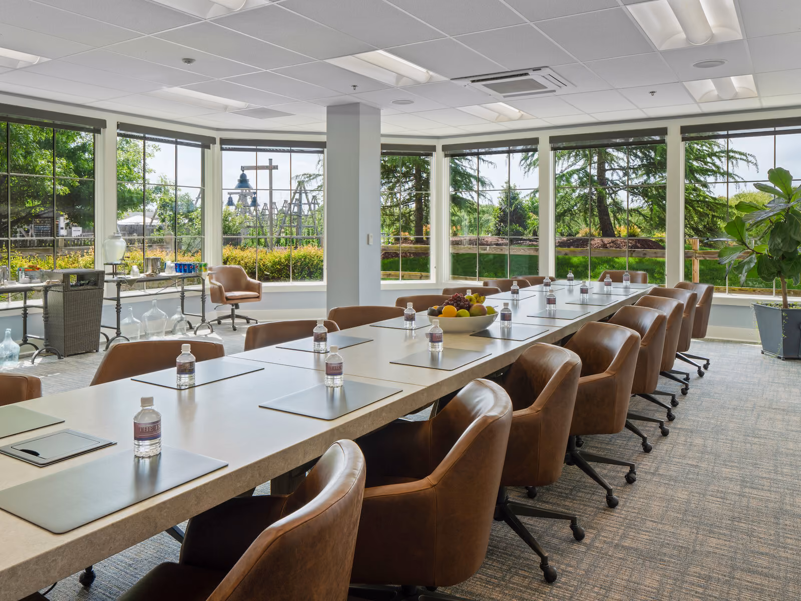 Hops Corner meeting room with long conference table, brown chairs, and windows overlooking the hops garden at The Inn at Chesapeake Bay Beach Club