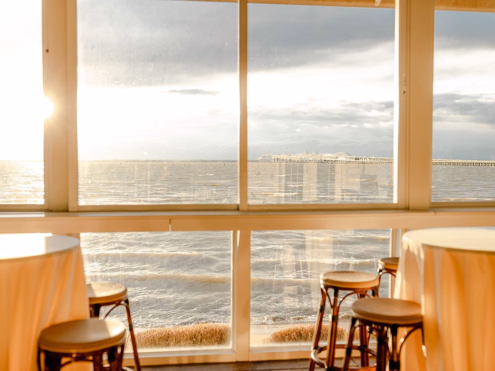 Guests enjoying the relaxed waterfront atmosphere at Tavern Bayside overlooking the Chesapeake Bay