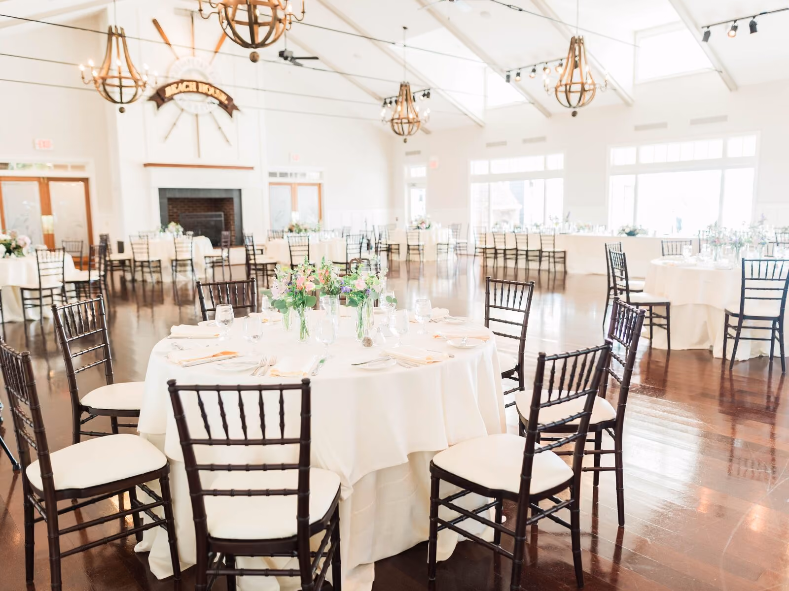 Beach House Ballroom reception-style layout with access to the waterfront terrace at Chesapeake Bay Beach Club