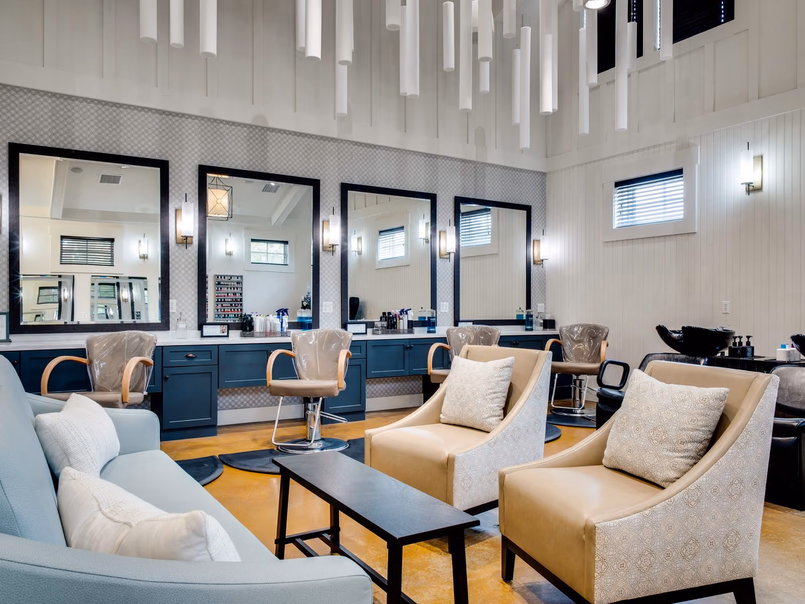 Bridal styling suite with salon chairs, lighted mirrors and lounge seating at Chesapeake Bay Beach Club