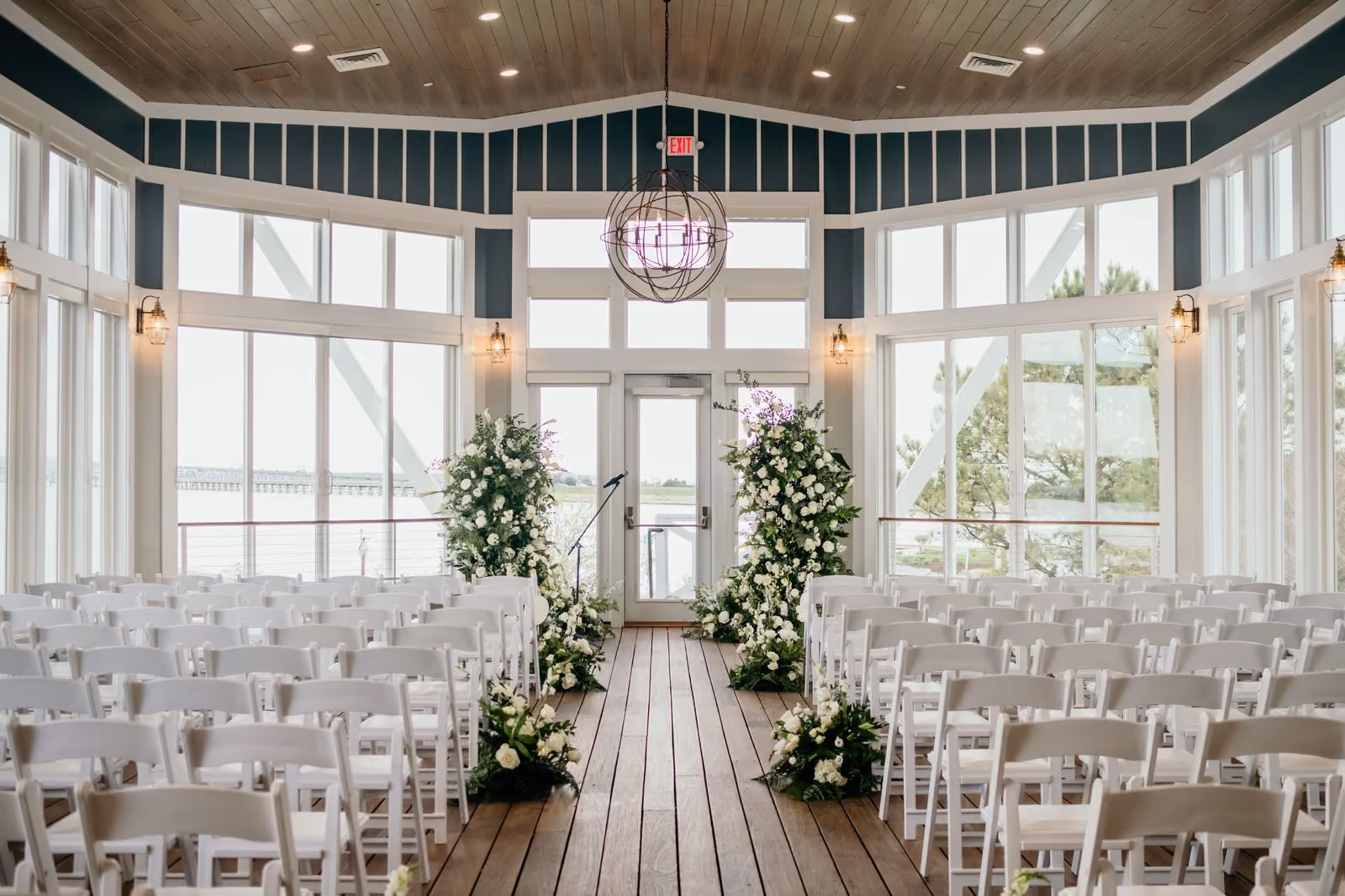 Waterfront rooftop wedding ceremony at sunset at Chesapeake Bay Beach Club