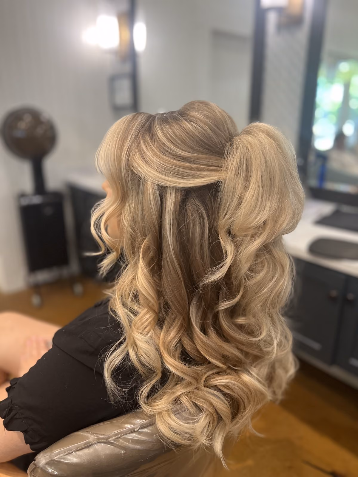 Blonde half-up bridal style with voluminous curls at Chesapeake Bay Beach Club