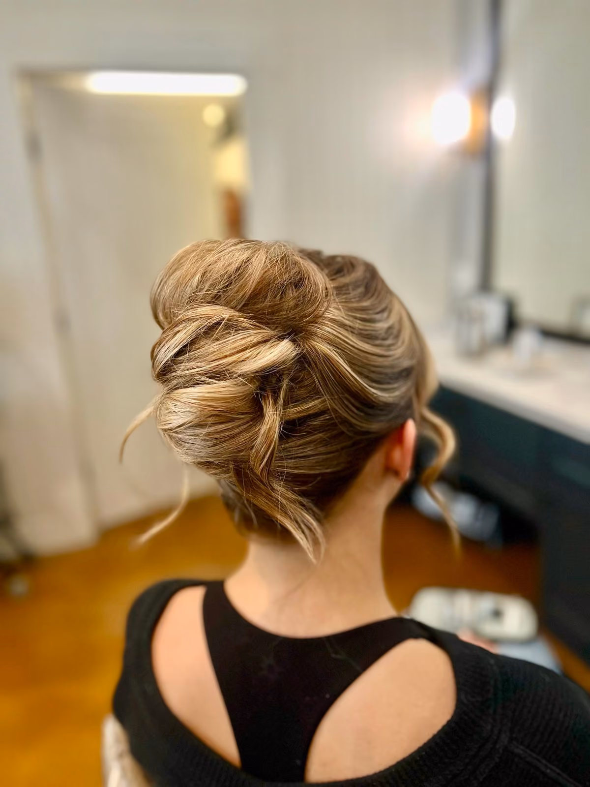 Voluminous blonde twisted bridal updo at Chesapeake Bay Beach Club